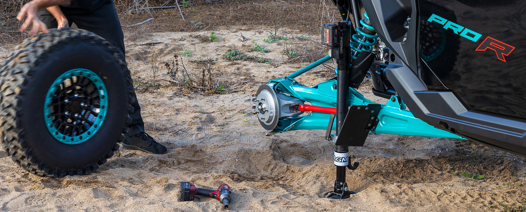 Changing a tire on a Polaris Pro R with an AGM Electric Jack Pro