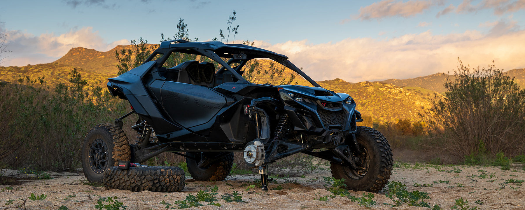 Changing a tire on a Can am Maverick R with an AGM Electric Jack Pro