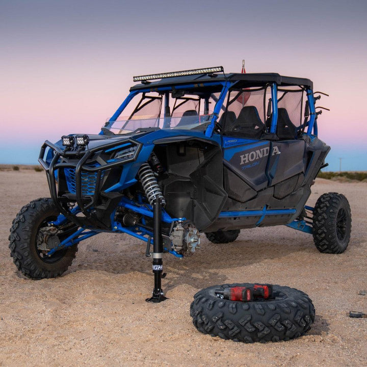 AGM Manual Jack lifting front of a Honda Talon